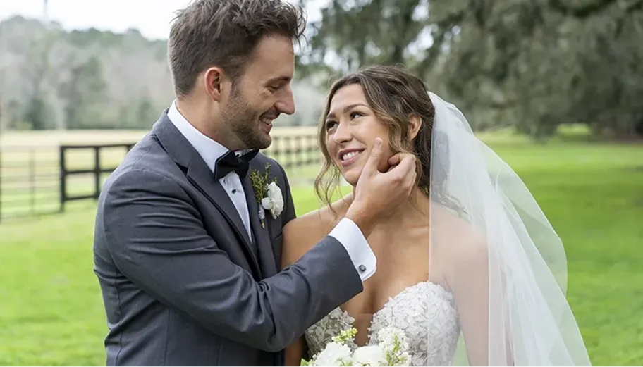 A newlywed couple smiling, captured by White Creek Weddings photography team